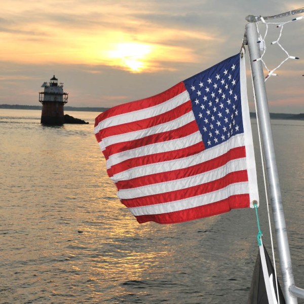 a close up of a boat next to a body of water