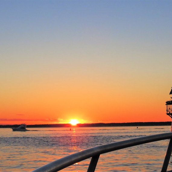 a close up of a boat next to a body of water