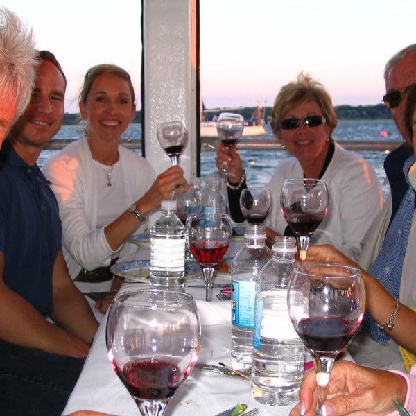 a group of people sitting at a table posing for the camera