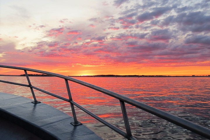 a sunset over a body of water