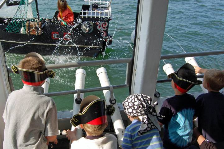 a group of people on a boat in the water