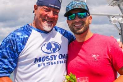 a man holding a fish