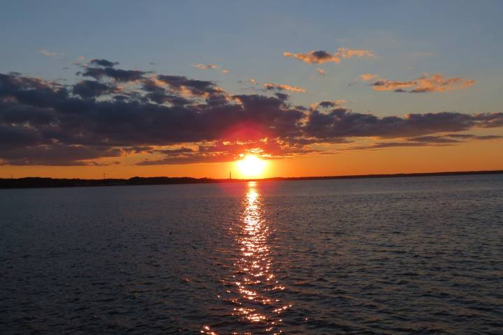 a sunset over a body of water