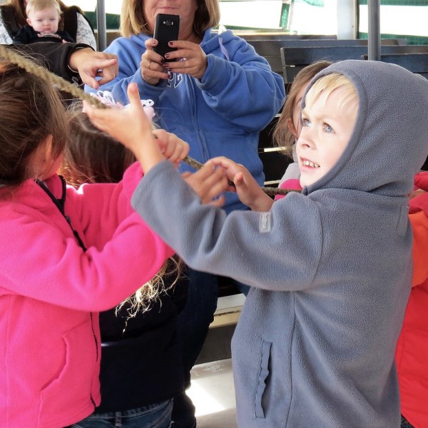 a little girl brushing her teeth