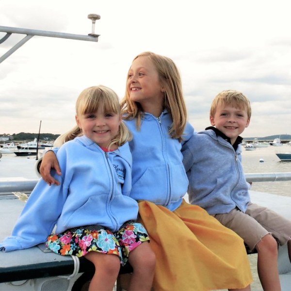 a small child sitting on a bench