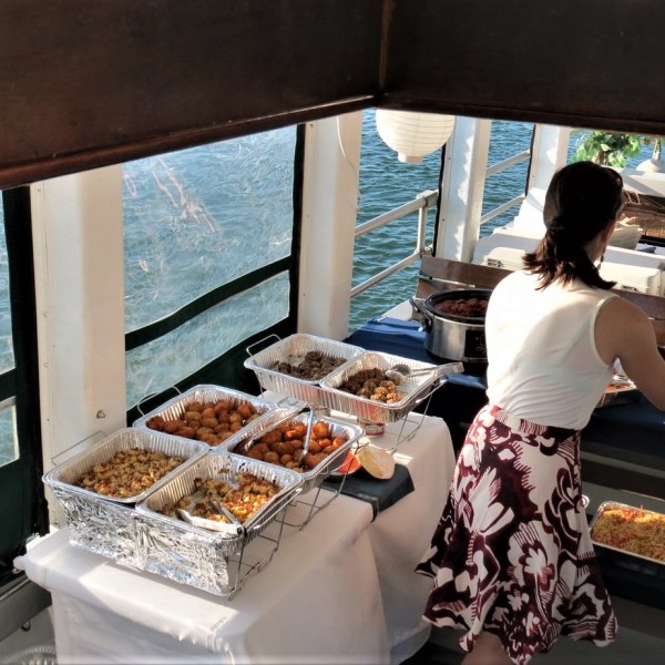 a person sitting at a table in front of a window