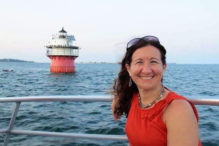 a person standing in front of a body of water