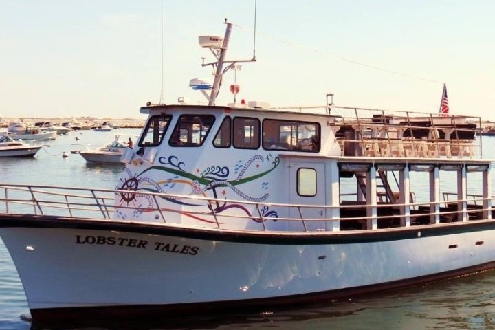 a boat is docked next to a body of water