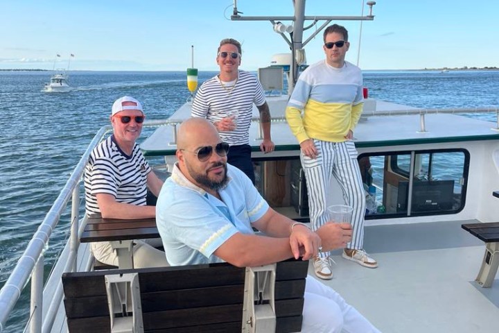 a couple of people that are sitting on a boat